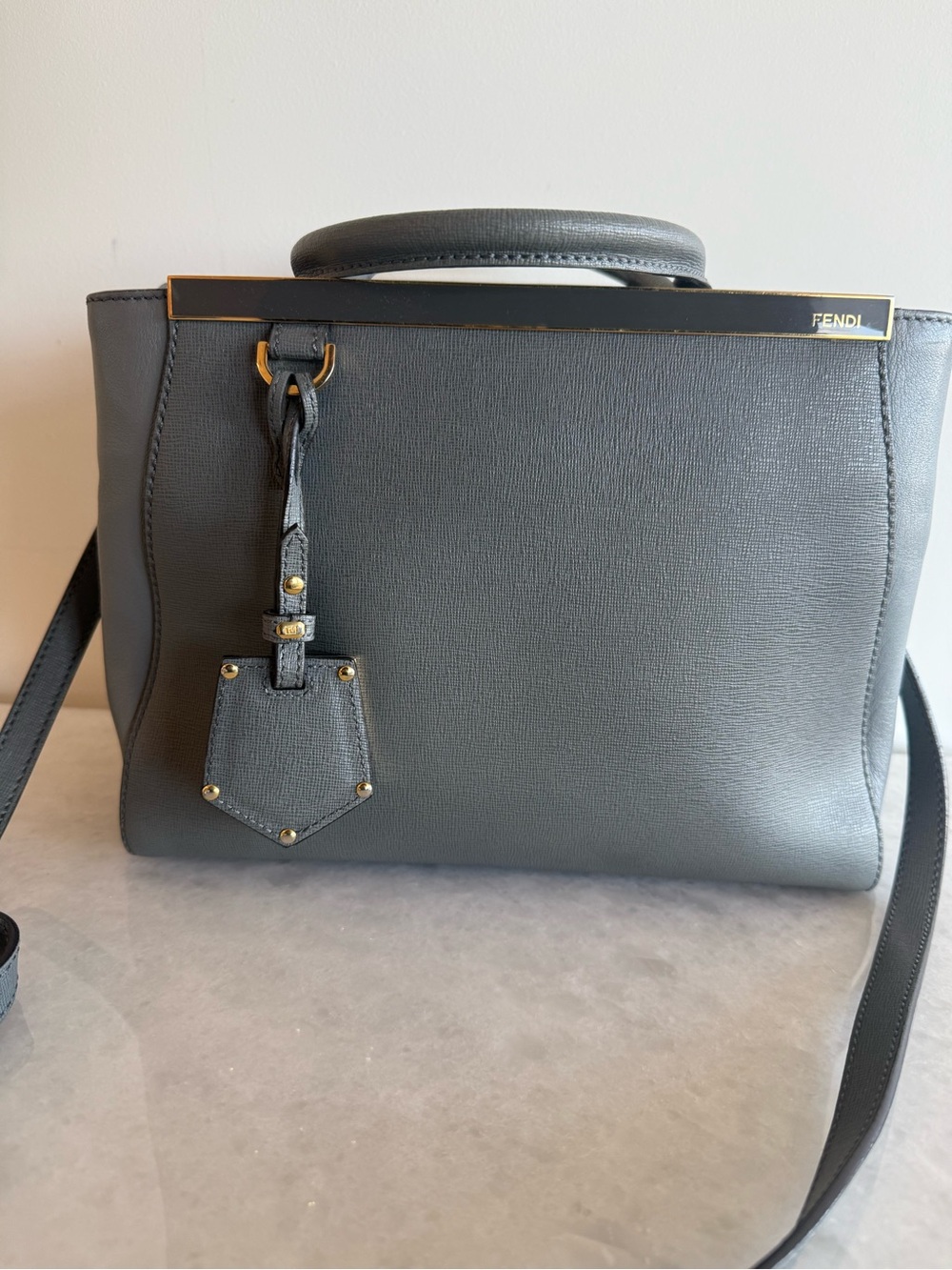 Fendi Petite 2 Jours
Grey with Gold hardware satchel top handle handbag